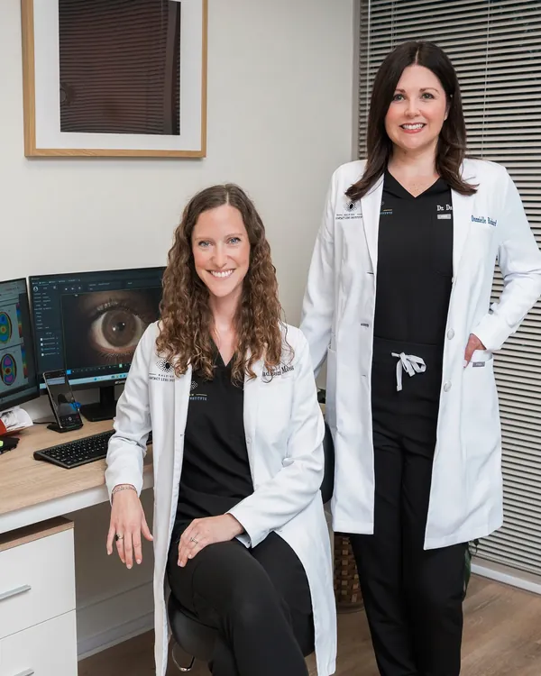 Dr. Madison Moss and Dr. Dannielle Richard evaluating corneal tomography scans for keratoconus