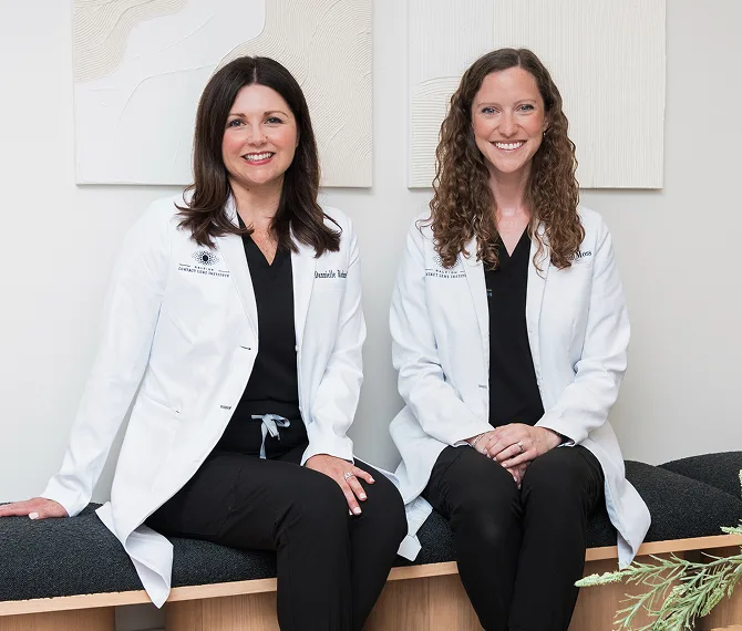 Dr. Richard and Dr. Moss seated together at The Raleigh Contact Lens Institute
