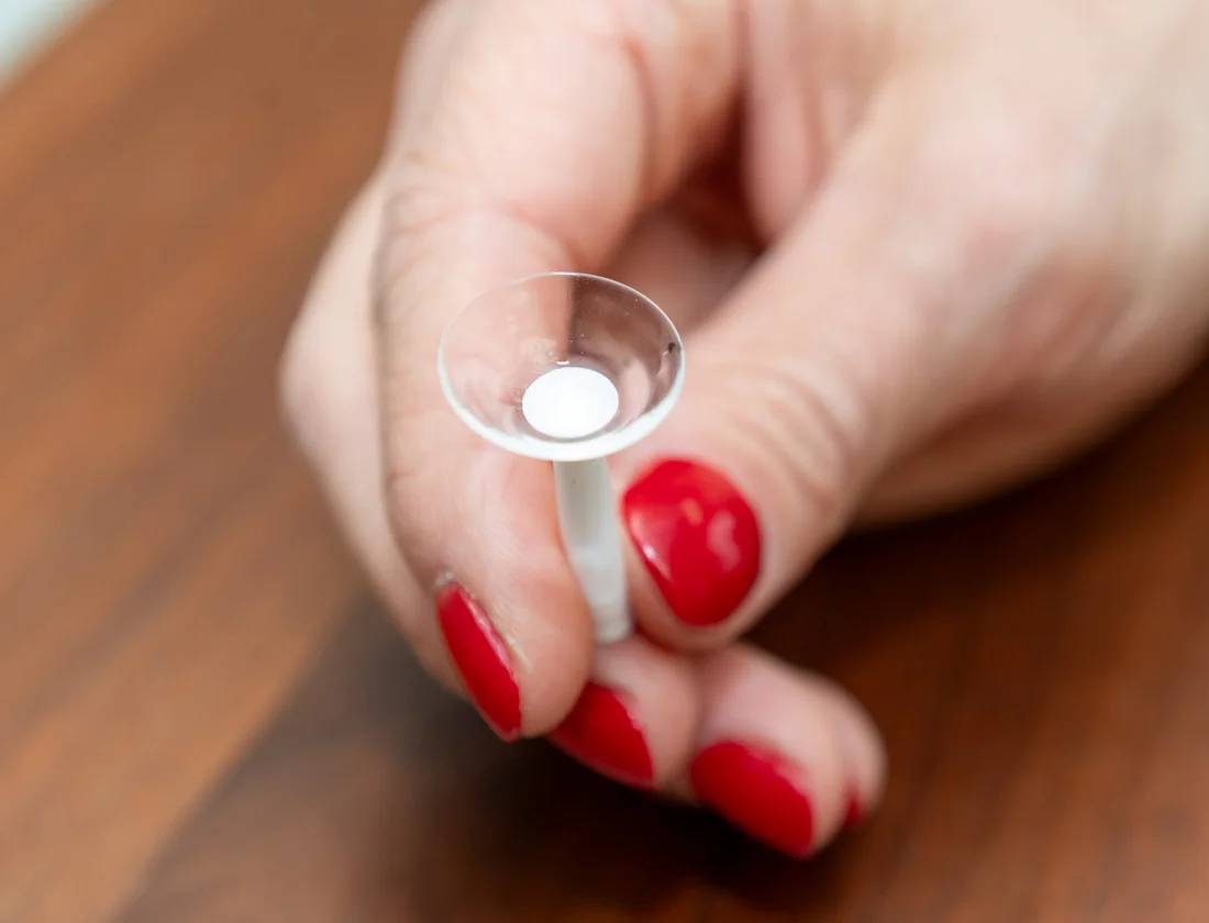 Scleral contact lens held on an insertion plunger