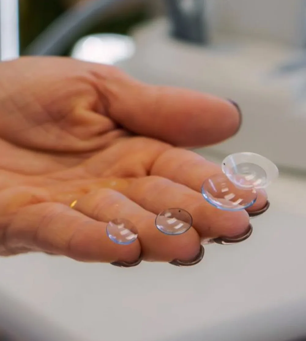 Specialty contact lenses resting on fingertips